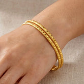 Lightweight Gold Plated Indian Bangles for Women worn on a hand, showcasing a stylish, classic design.