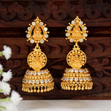 Gold Plated CZ Stone Lakshmi Temple Jhumka earrings with ornate design and sparkling stones.