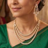 CZ Stone 3-Layer Necklace Set with Chandelier Earrings worn by a woman, showcasing elegant jewelry design.