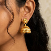 Traditional Gold Plated Filigree Jhumka Earrings showcasing intricate details and golden bead danglers.