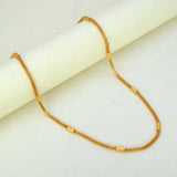 Elegant Gold Plated Mesh Pipe Chain displayed elegantly on a smooth surface, highlighting its delicate design and cylindrical accents.