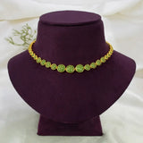 A Gold-Plated Round Design Stone Necklace displayed on a dark purple velvet jewelry bust against a soft white fabric background.