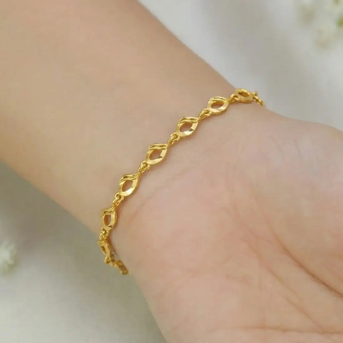 Lightweight Gold-Plated Designer Link Bracelet worn on a wrist, showcasing elegant link details and a refined style.