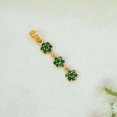 A Gold-Plated Three-tier Stone Floral Drop Pendant featuring three small green emerald floral clusters connected by gold loops, displayed on a textured white fabric background.