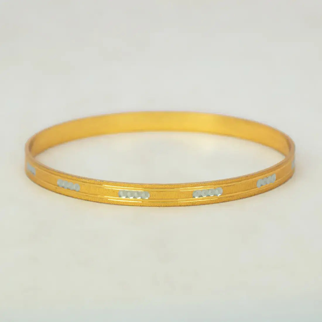 Gold & Rhodium Plated Dual-Tone Bangle showcasing elegant gold base with textured rhodium accents.