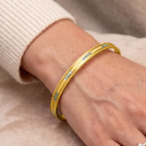 Gold & Rhodium Plated Dual-Tone Bangle worn on a wrist, showcasing its elegant dual-tone design.