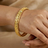 Gold Plated Mesh Diamond Design Net Bangle worn on a hand, showcasing intricate mesh pattern and shiny diamond-cut details.