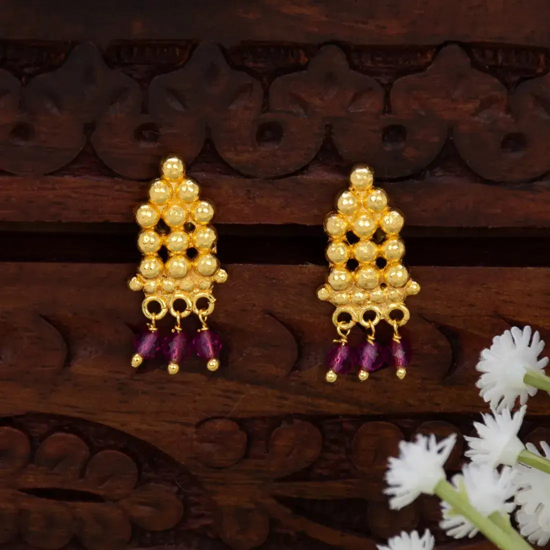 Gold Plated Crystal Hanging Beaded Studs featuring gold beads and ruby-red crystal dangles.