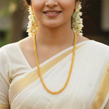 Gold Plated Double Layer Beads Chain worn by a woman in a traditional sari.