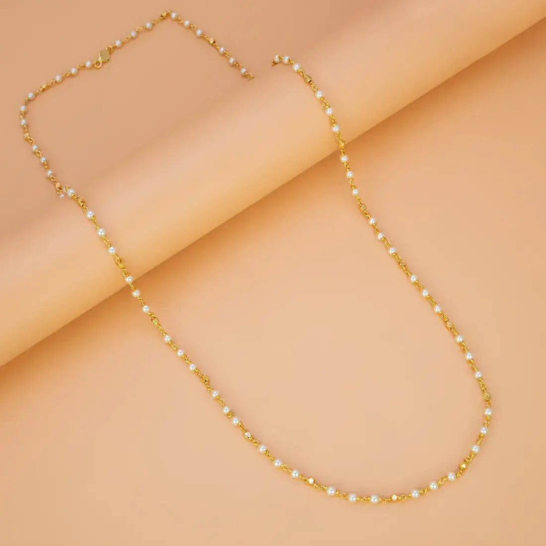 Gold Plated Pearl Mala Chain featuring shiny pearl beads and delicate gold accents for an elegant look.