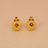 Gold Plated Floral Stone Studded Stud Earrings featuring textured gold and ruby stones.