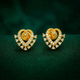 Dazzling Gold Plated Stone Heart Stud Earrings with sparkling stones and gold detailing on a green background.