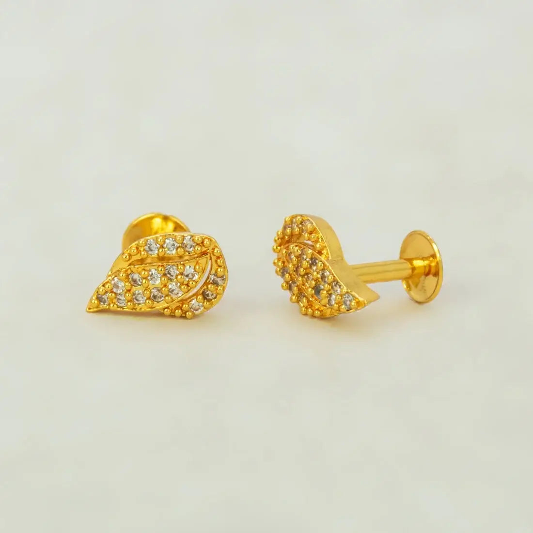Gold Plated Leaf Model Stone Stud Earrings featuring Ruby/CZ stones and elegant leaf design.