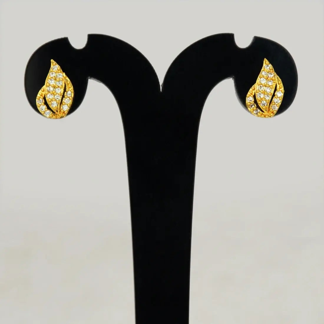 Gold Plated Leaf Model Stone Stud Earrings featuring vibrant stones in a unique leaf design, perfect for elegant style.
