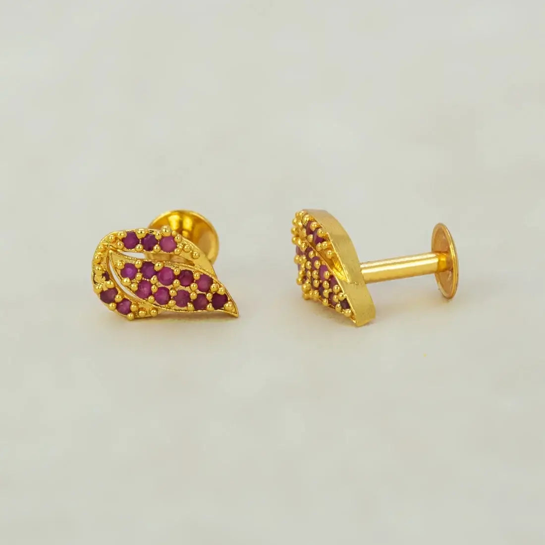 Gold Plated Leaf Model Stone Stud Earrings with Ruby/CZ stones, featuring elegant leaf design and gold finish.
