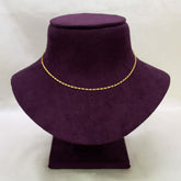 A Gold Plated Thin Titanic Chain for Kids displayed on a purple velvet jewelry bust against a light gray background.