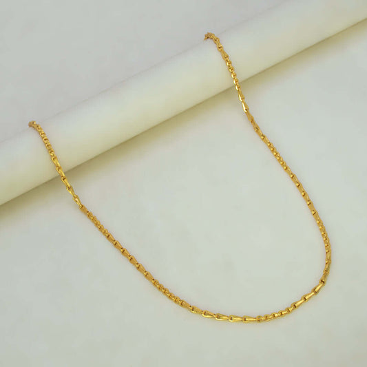 Stylish Gold Plated Cutting Bhanu Priya Chain displayed on a smooth surface, showcasing its elegant design and shine.