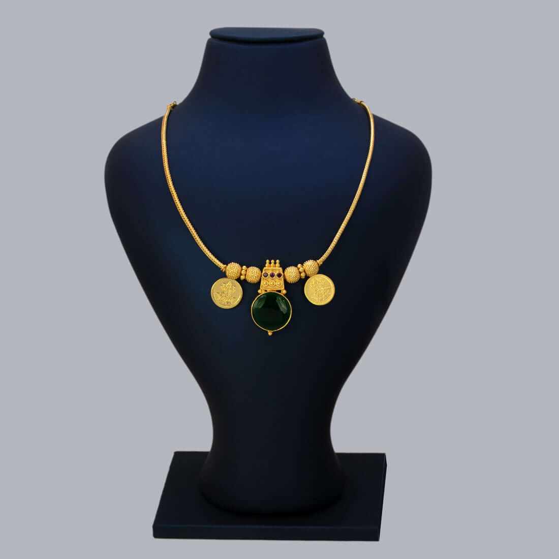 Green Enamel Gold Plated Lakshmi Kasu Necklace showcasing lush green stone pendant and Lakshmi coins.
