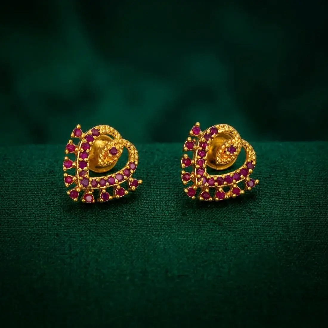 Dazzling Gold Plated Stone Heart Stud Earrings featuring vibrant stones and a layered heart design.