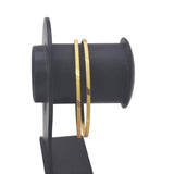 Thin Gold Plated Designer Daily Wear Bangles for Girls displayed on a stand.
