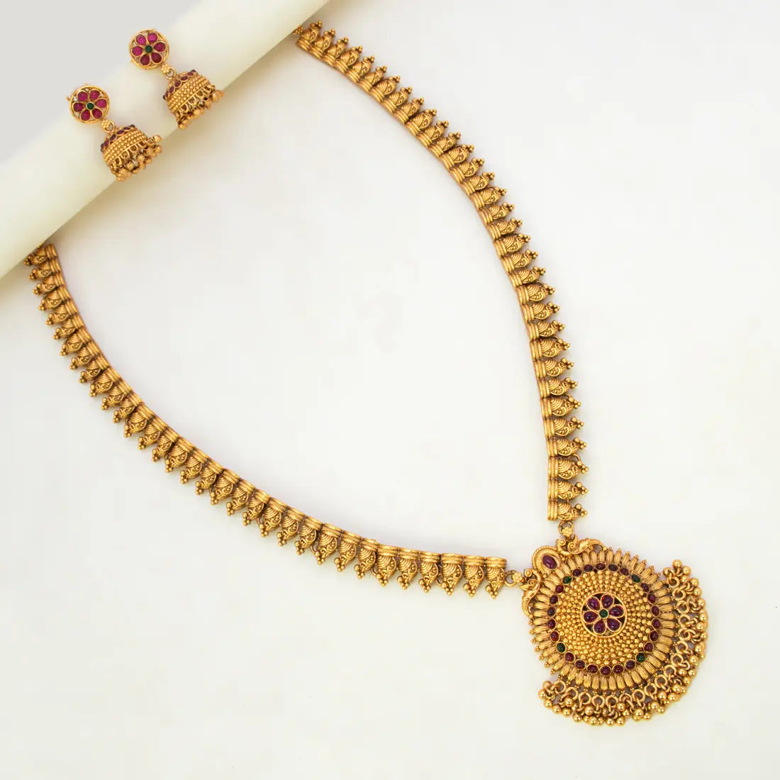 Kemp Stone Antique Long Haram Set for Women featuring intricate design and circular pendant with matching earrings.