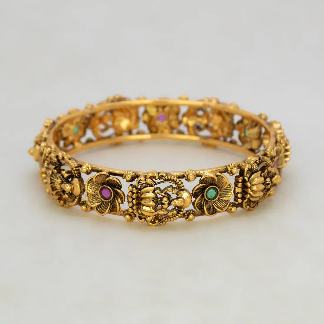 Kemp Stone Floral Lakshmi Antique Kada Bangle featuring intricate floral designs and colorful gemstones.