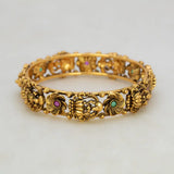 Kemp Stone Floral Lakshmi Antique Kada Bangle featuring intricate floral designs and colorful gemstones.