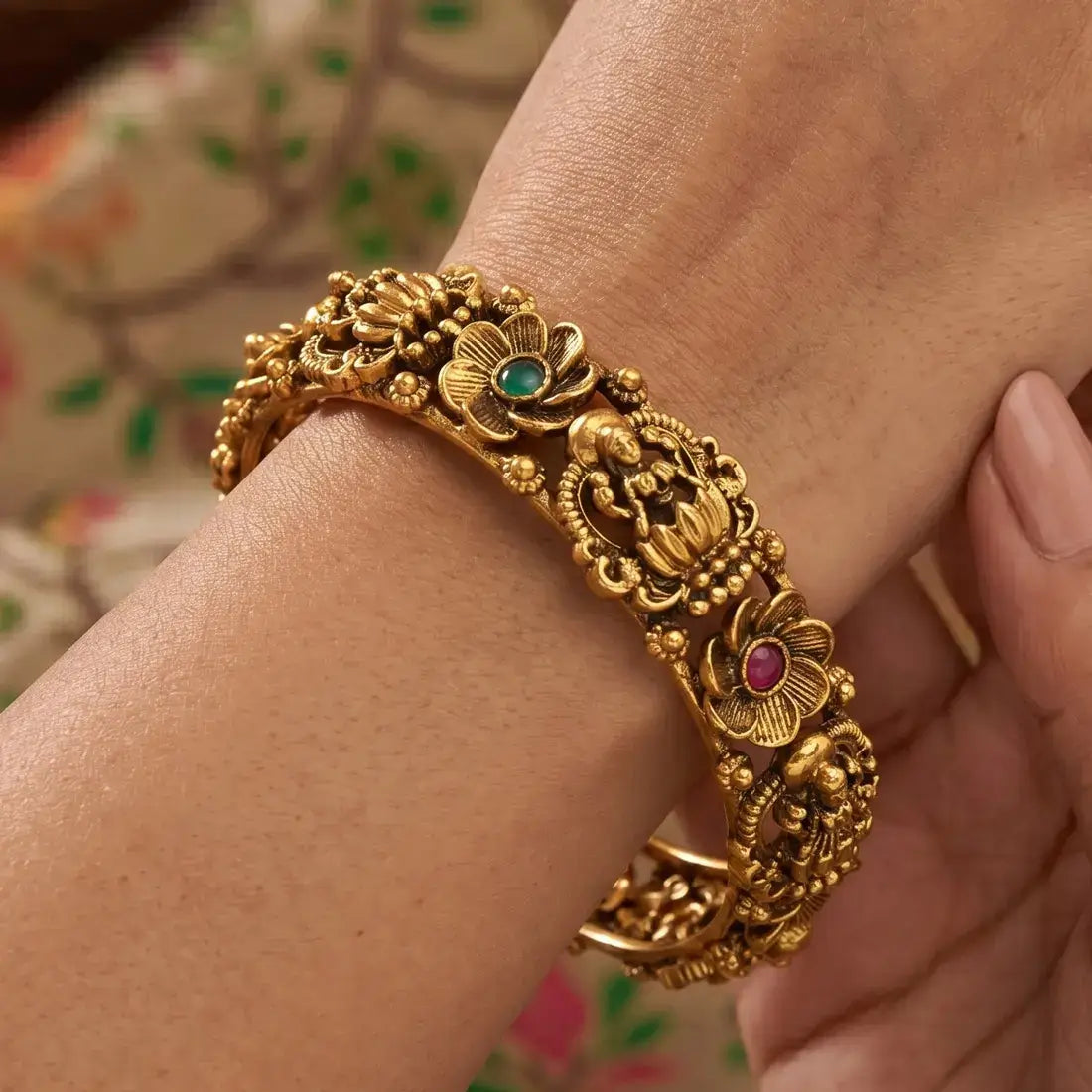 Kemp Stone Floral Lakshmi Antique Kada Bangle featuring intricate floral designs and vibrant gemstones.