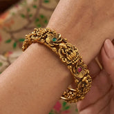 Kemp Stone Floral Lakshmi Antique Kada Bangle featuring intricate floral designs and vibrant gemstones.