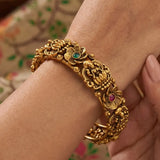 Kemp Stone Floral Lakshmi Antique Kada Bangle featuring intricate floral designs and vibrant gemstones.