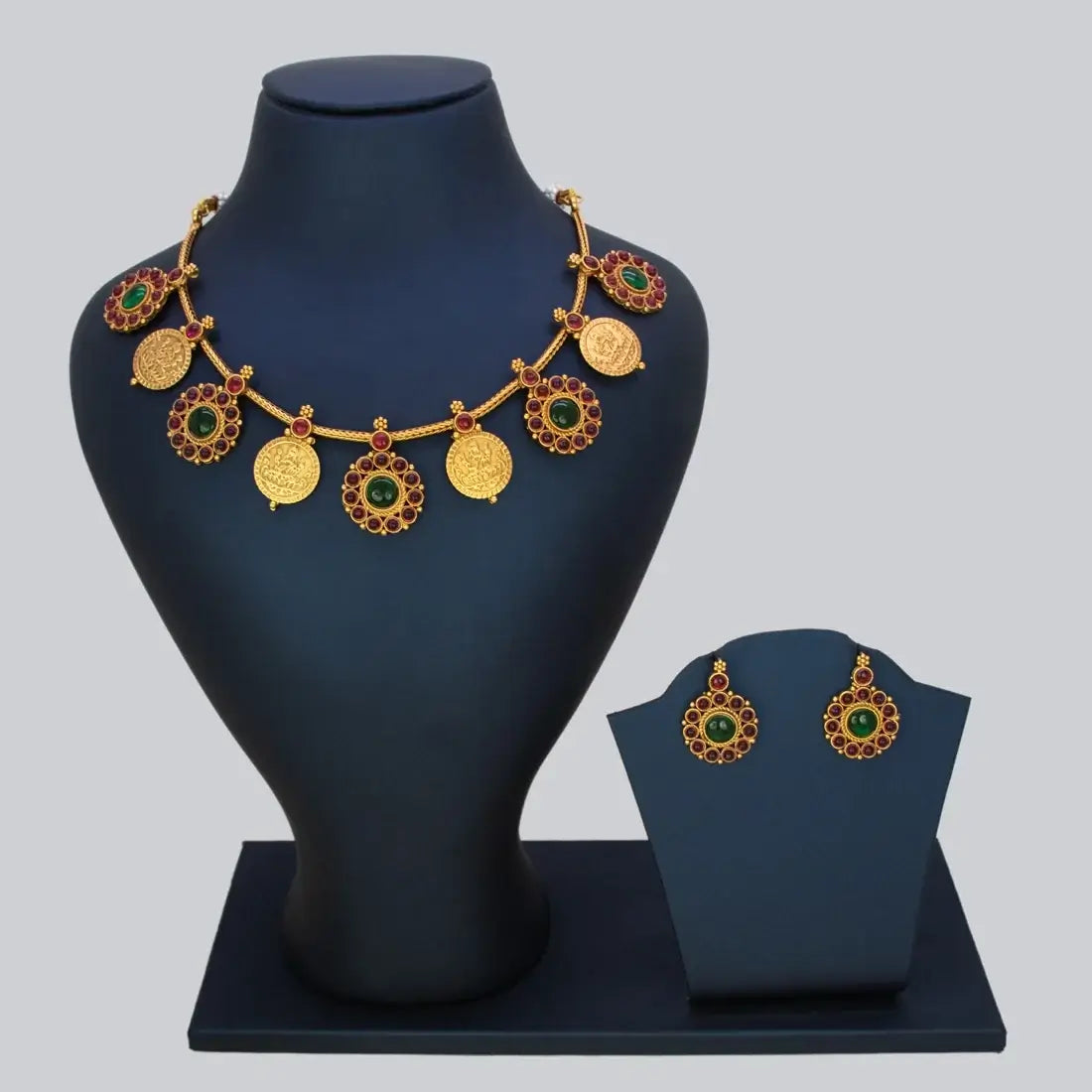 Antique Matte Floral Kemp Stone Lakshmi Kasu Necklace Set displayed on a mannequin with matching earrings.