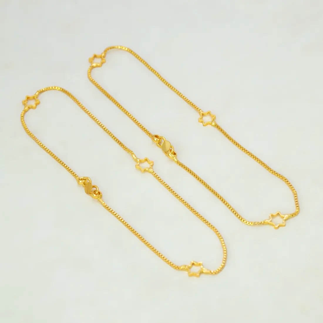 Delicate Gold Plated Star Box Chain Anklets featuring open star charms on a fine gold chain.