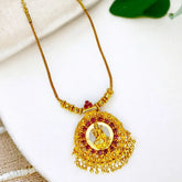 Ethnic Gold Plated Ruby Stones Lakshmi Pendant Necklace with intricate design and gold bead dangles.
