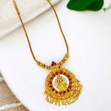 Ethnic Gold Plated Ruby Stones Lakshmi Pendant Necklace with intricate design and gold bead dangles.