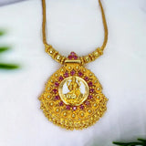 Ethnic Gold Plated Ruby Stones Lakshmi Pendant Necklace decorated with ruby stones and intricate gold bead detailing.