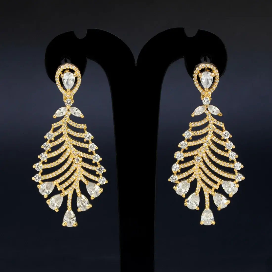 Gold-Plated American Diamond Leaf Earrings showcasing intricate CZ stone detailing and a luxurious feather silhouette.