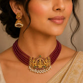 Ethnic Matte Lakshmi Ruby Emerald Choker Set worn by a woman, featuring goddess Lakshmi design with Kundan stones.