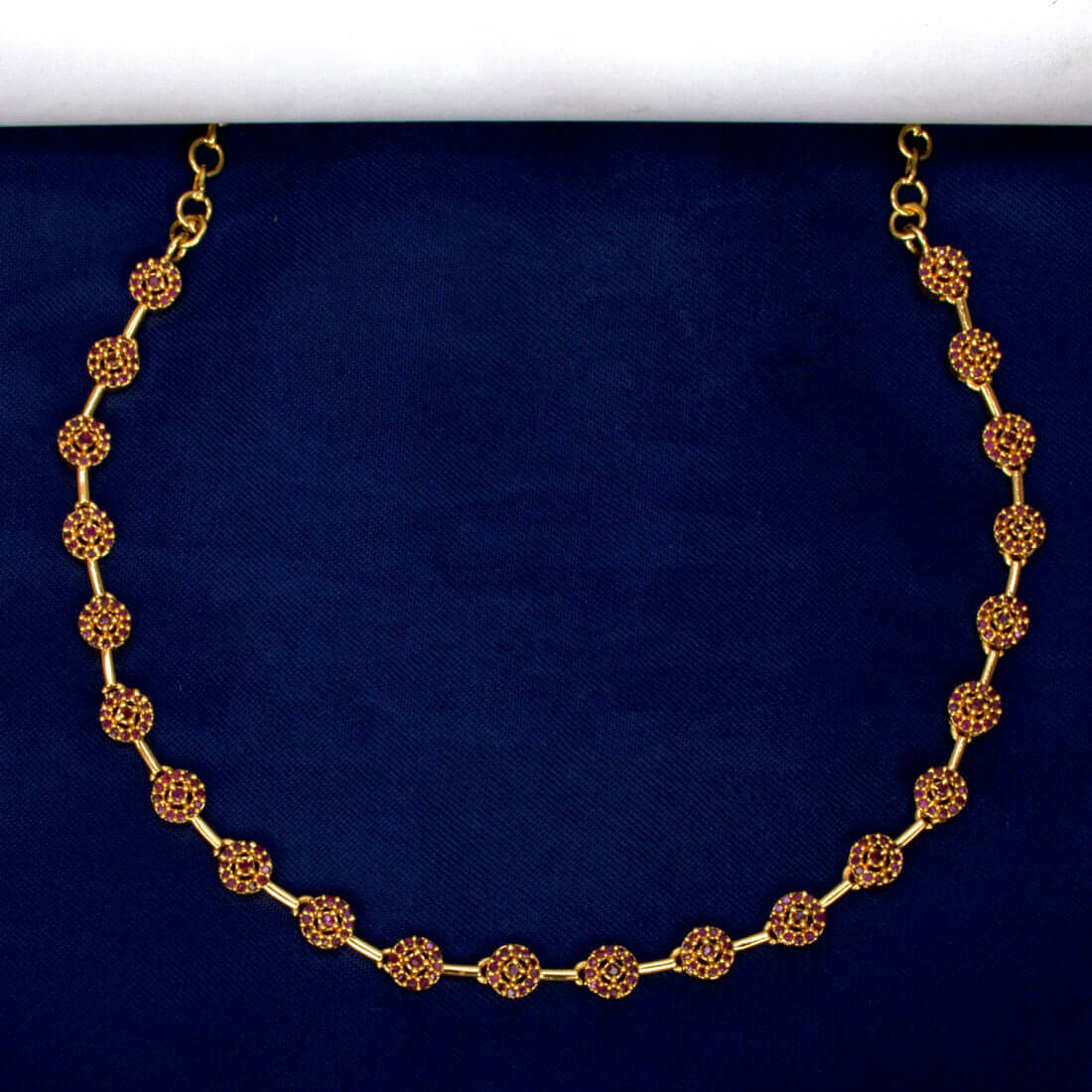 Marvelous Gold Plated Round Stone Necklace featuring round ruby stones on a gold chain.