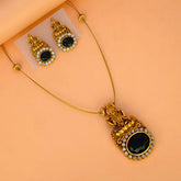 Gorgeous Matte Lakshmi Black CZ Pendant Set featuring a Lakshmi motif and black CZ stones on a gold chain.