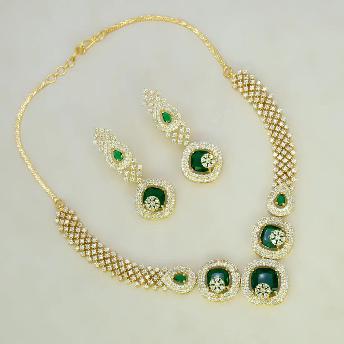 CZ Stone Necklace Set featuring emerald green stones and sparkling CZ accents in gold-plated finish.