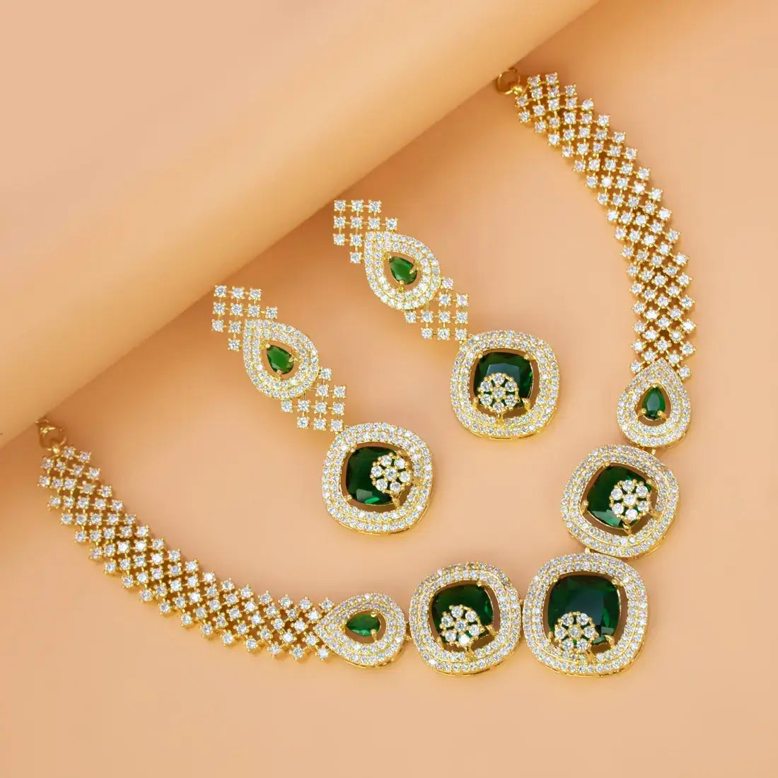 CZ Stone Necklace Set featuring gold-plated design with emerald green stones and sparkling Cubic Zirconia for elegant parties.