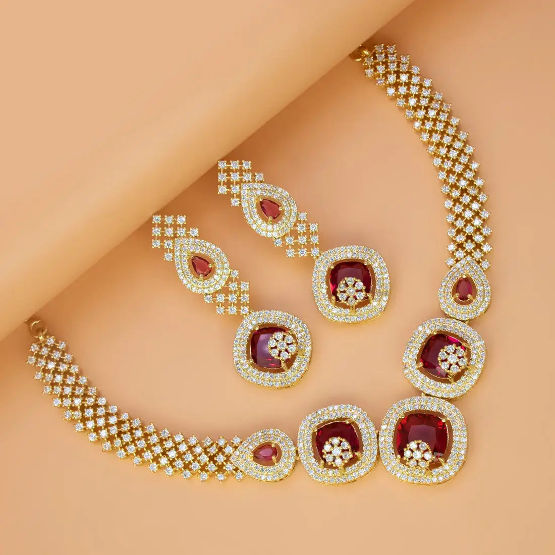 CZ Stone Necklace Set featuring Ruby Red and Cubic Zirconia stones, elegant gold-plated party jewellery.