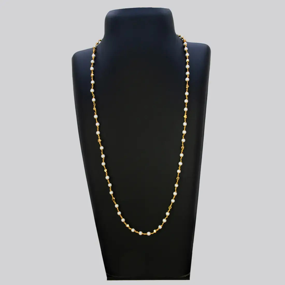 Gold Plated Big Pearl And Golden Beads Mala Chain displayed on a black necklace stand.