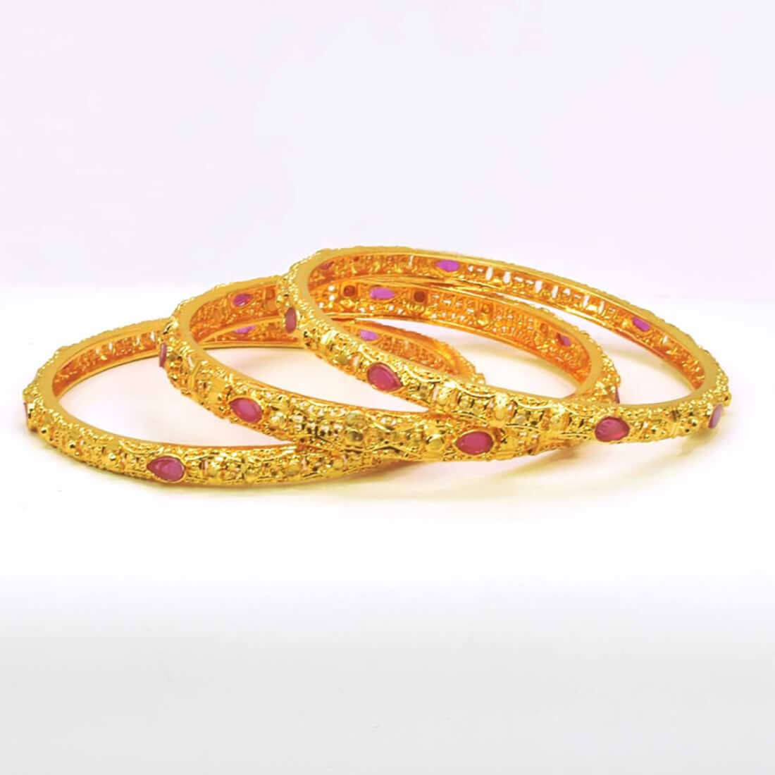 Premium Golden Ruby Stone Bangles Set featuring golden finish and vibrant ruby stones, perfect for any occasion.