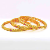 Premium Golden Ruby Stone Bangles Set featuring golden finish and vibrant ruby stones, perfect for any occasion.
