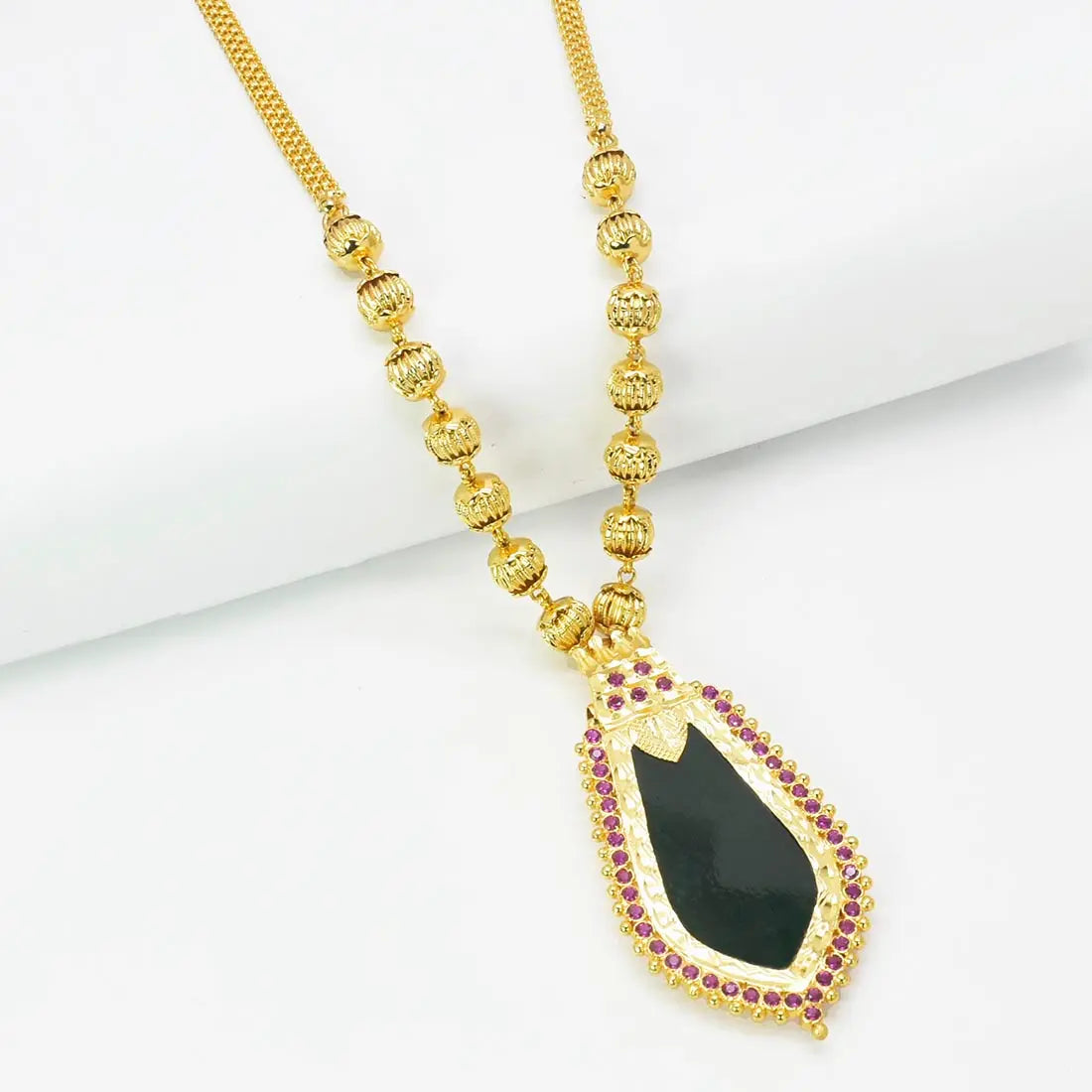 Premium Gold Plated Ball Necklace With Nagapadam Pendant featuring a black stone centerpiece and ruby accents.