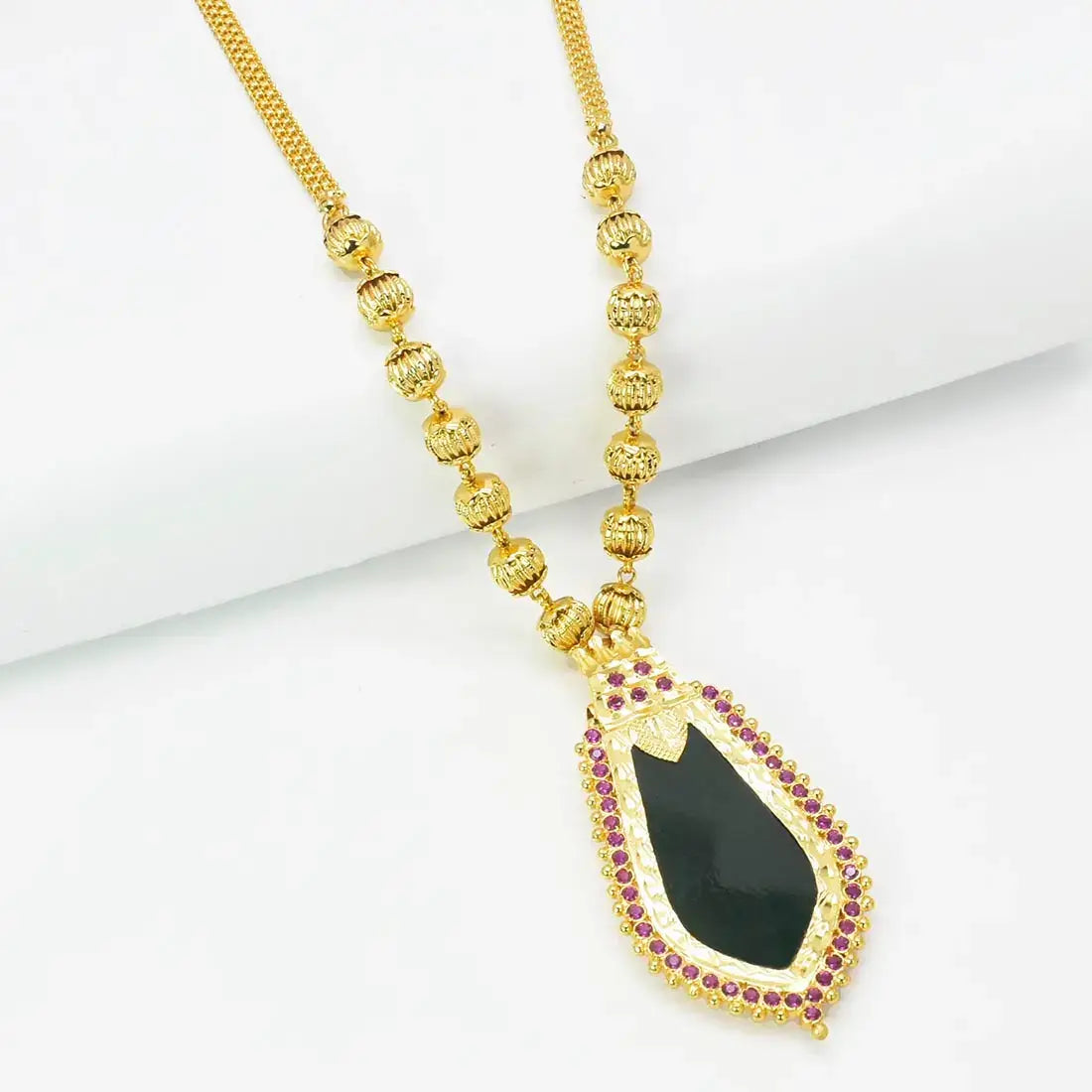 Premium Gold Plated Ball Necklace With Nagapadam Pendant featuring a black stone centerpiece and ruby accents.
