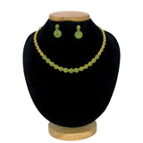 A Premium Gold Plated Round Emerald Necklace Set consisting of a necklace and matching earrings, displayed on a black velvet jewelry bust with a wooden base against a white background.