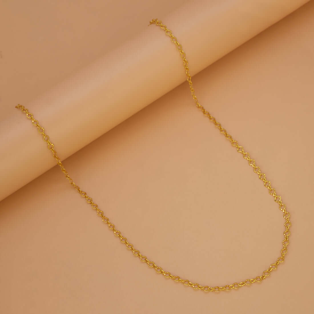 Light-Weight Gold Plated Pulimurugan Chain displayed on a soft, neutral background showcasing its polished finish.