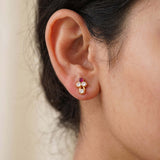 Cute Stone Studs for Second Lobe showcased on a model's ear, featuring a floral design and sparkling stones.